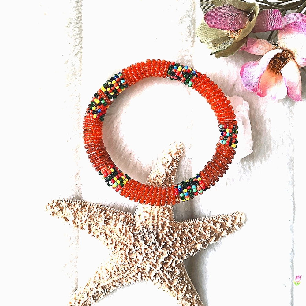 Colourful Beaded Bracelet Wrapped around a circular form.